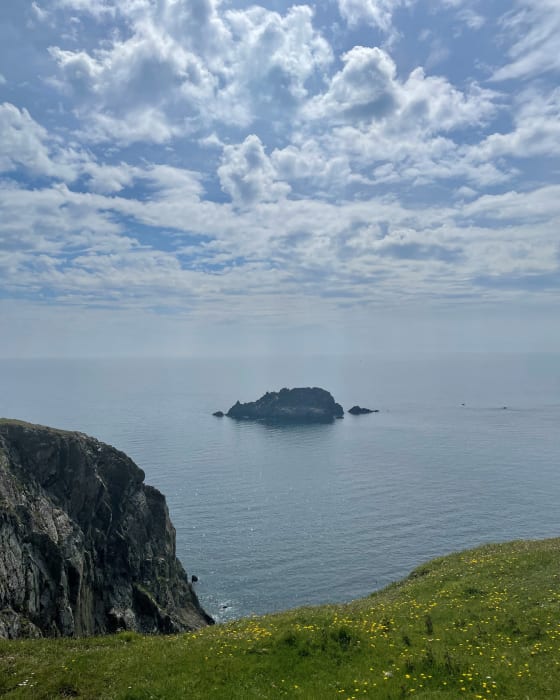 A small island rock in a blue Cornish sea The view from Nare Head